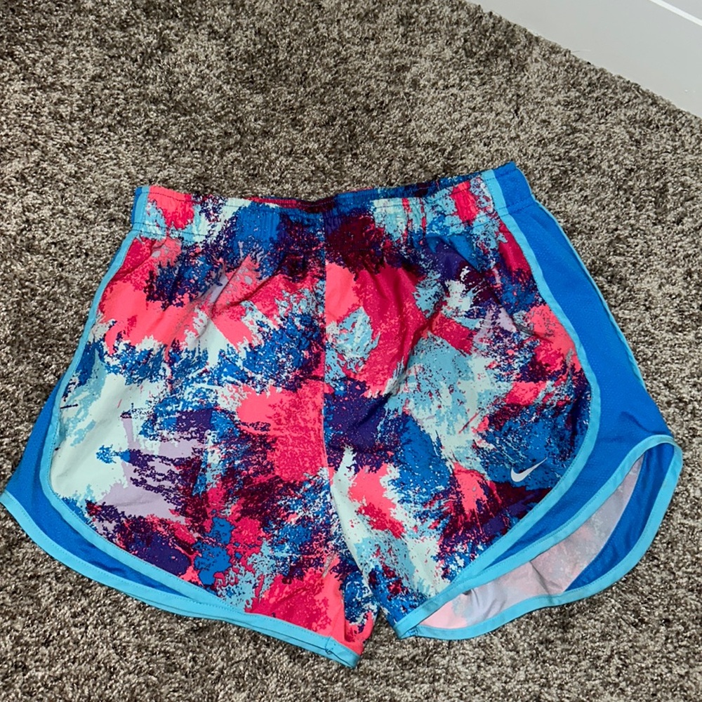 Nike dry-fit athletic shorts, size Small, multicolor splatter design, blue trim